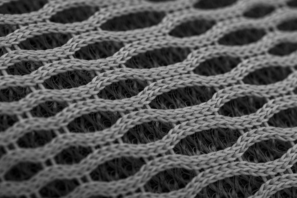 Gros plan texture polyamide gris tricote