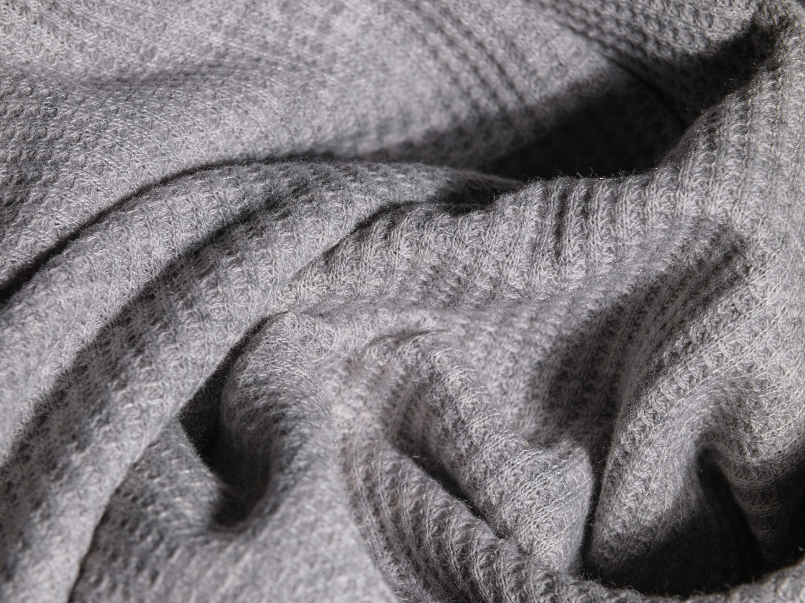 Gros plan tissu tricot gris texture douce